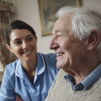 Caregiver supporting senior man at home during recovery with home health care in Greenfield, IN.